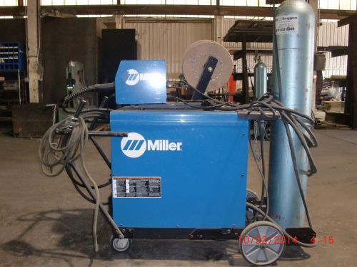 Miller model cp302 welder with swing arm and wire feeder for sale