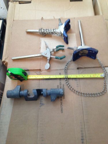 Two beaker holders ( chain type ) &amp; one test tube holder &amp; one clamp for sale