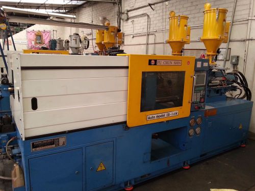 Injection molding machine 140 tons, Two shots 3 onz. each unit. Year: 2003