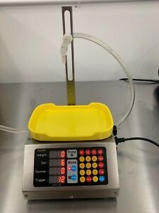 liquid filler weighed, used, works well for oils