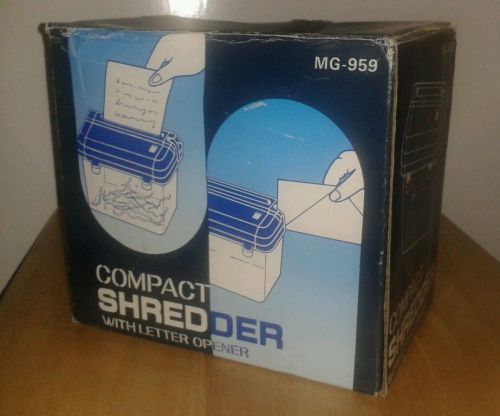 MINI COMPACT PAPER SHREDDER WITH LETTER OPENER. SHREDS LETTERS, ETC. HANDY!